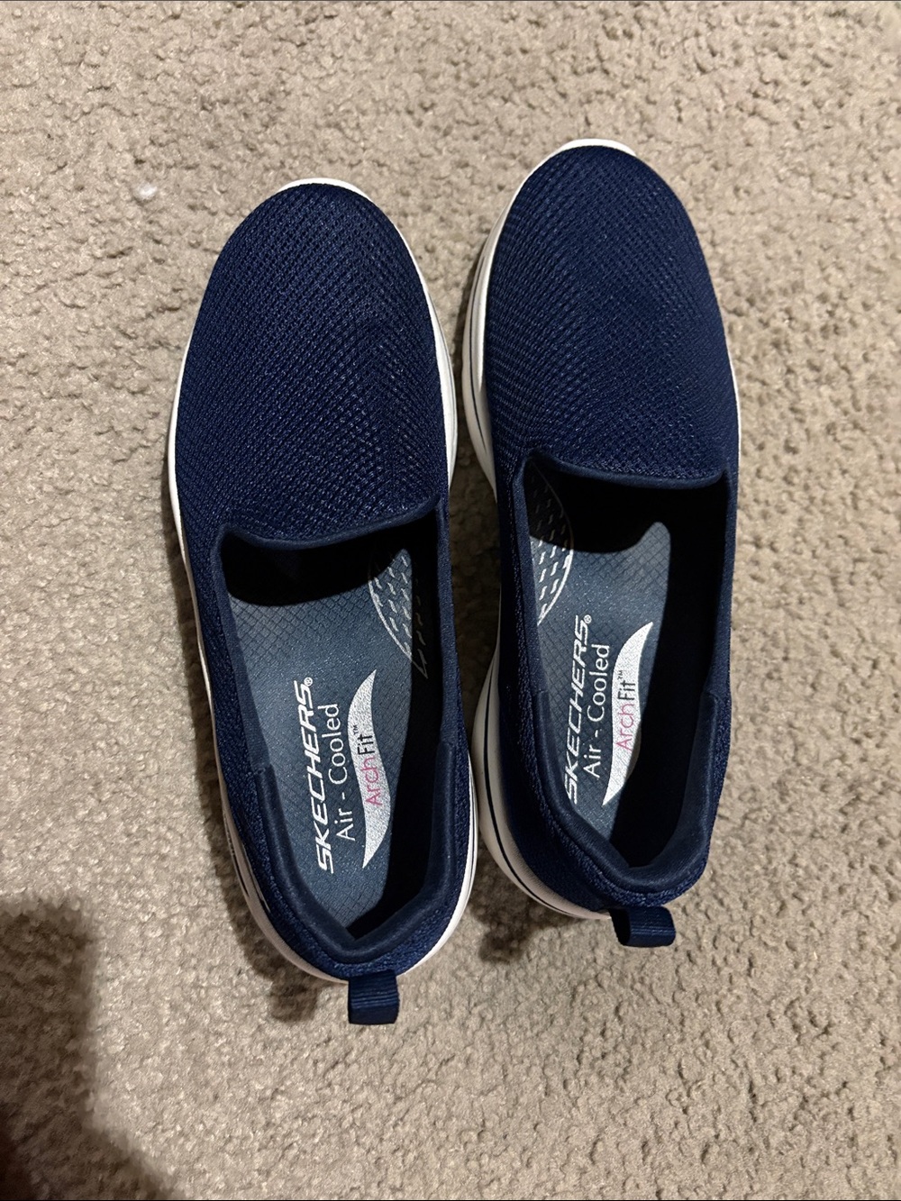Skechers women’s Navy Slip-On Knit Sneakers